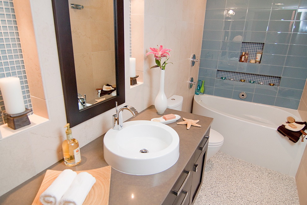 Example of a transitional bathroom design in Other with a console sink