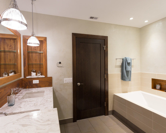 Photo of a medium sized classic ensuite bathroom in Chicago with flat-panel cabinets, medium wood cabinets, an alcove bath, an alcove shower, a two-piece toilet, white tiles, ceramic tiles, white walls, ceramic flooring, a submerged sink and marble worktops.