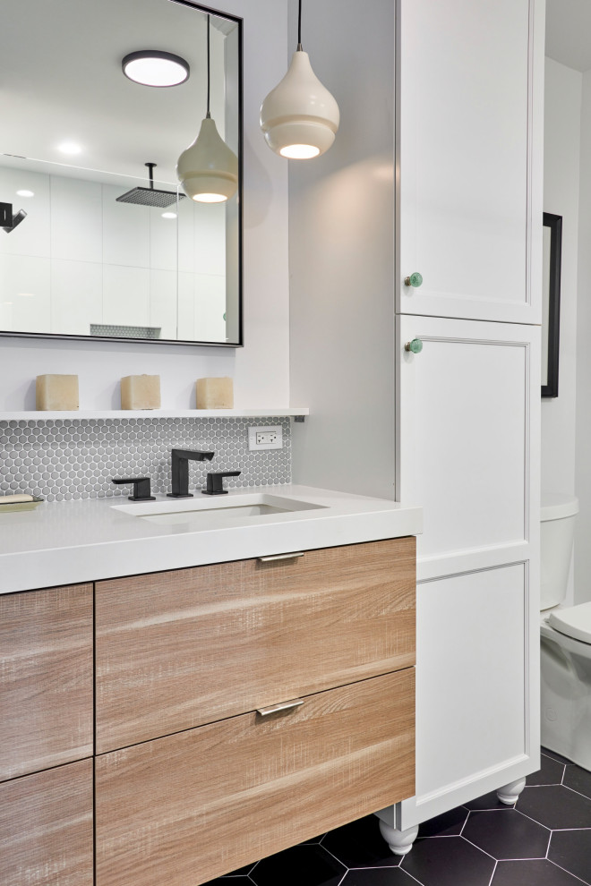 Small trendy master gray tile and mosaic tile ceramic tile, black floor and double-sink bathroom photo in Chicago with medium tone wood cabinets, a two-piece toilet, white walls, granite countertops, white countertops, flat-panel cabinets, an undermount sink and a floating vanity