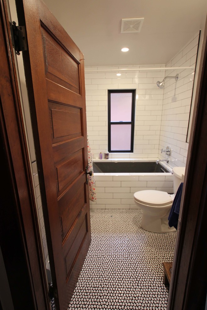 This is an example of a medium sized modern family bathroom in Denver with a submerged bath, a shower/bath combination, white tiles, metro tiles, ceramic flooring, white floors and a shower curtain.