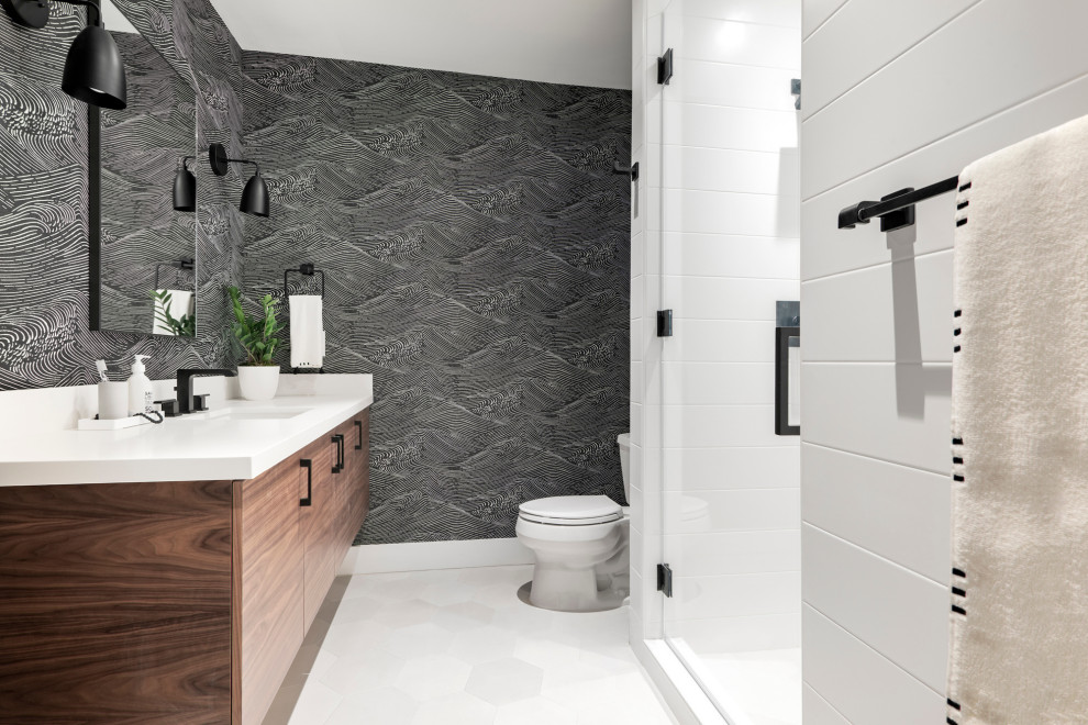 Photo of a large contemporary shower room bathroom in Miami with flat-panel cabinets, medium wood cabinets, an alcove shower, a two-piece toilet, multi-coloured walls, a submerged sink, white floors, a hinged door, a floating vanity unit, wallpapered walls, grey tiles, white worktops and a single sink.