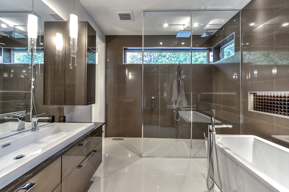 Mid-sized minimalist beige tile bathroom photo in Montreal with flat-panel cabinets, brown cabinets and quartz countertops