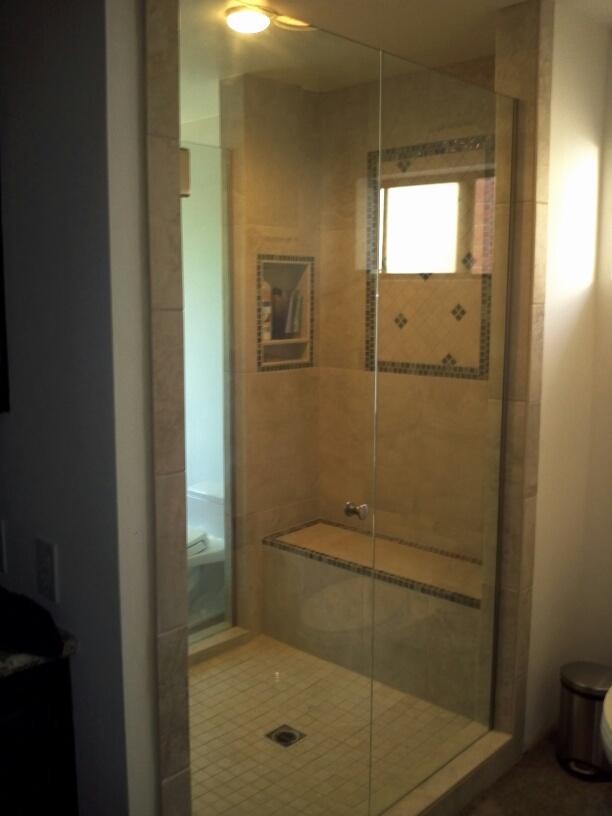 Inspiration for a large timeless master porcelain tile doorless shower remodel in Los Angeles with granite countertops