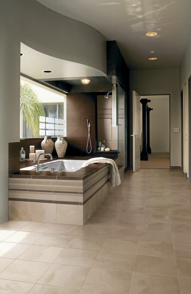 На фото: главная ванная комната в современном стиле с угловым душем, бежевой плиткой, керамогранитной плиткой, серыми стенами, полом из керамогранита, накладной ванной и бежевым полом