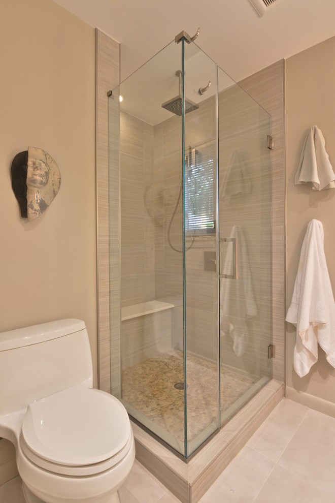 Example of a small trendy master beige tile and porcelain tile porcelain tile alcove shower design in Houston with a one-piece toilet and beige walls