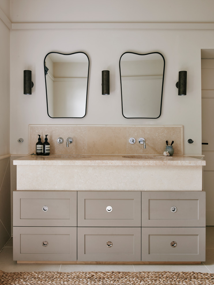 Photo of a medium sized traditional grey and cream ensuite bathroom in Wiltshire with beige tiles, ceramic tiles, limestone worktops, beige worktops, shaker cabinets, beige cabinets, beige walls and beige floors.