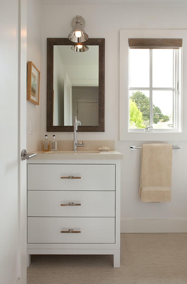 Inspiration for a contemporary bathroom in San Francisco with a submerged sink, flat-panel cabinets and white cabinets.