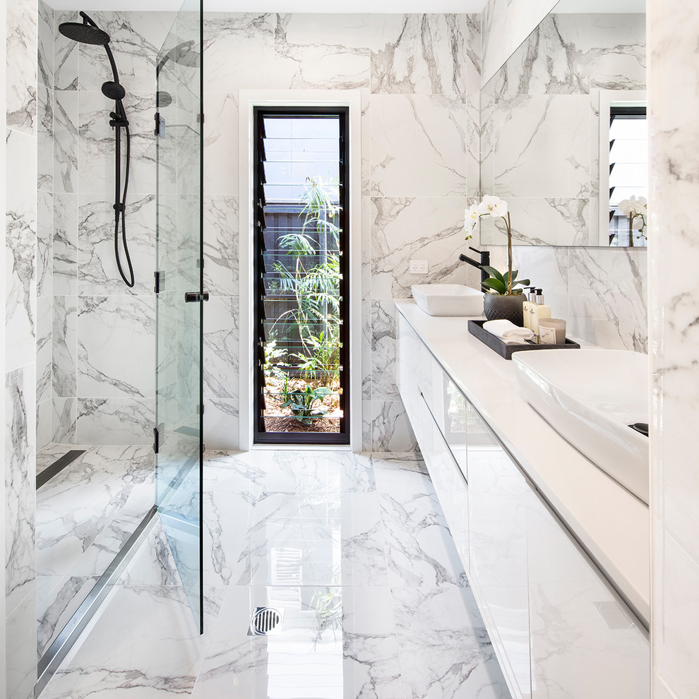 Example of a trendy white tile white floor alcove shower design in Brisbane with flat-panel cabinets, white cabinets, a vessel sink and white countertops