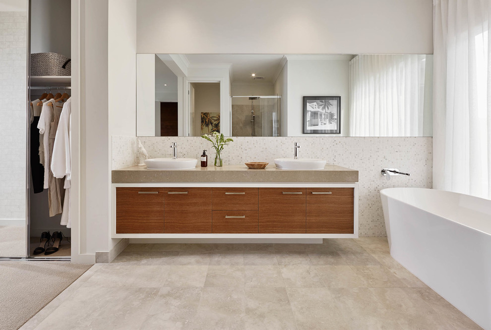 Contemporary ensuite bathroom in Melbourne with flat-panel cabinets, medium wood cabinets, a freestanding bath, an alcove shower and white walls.