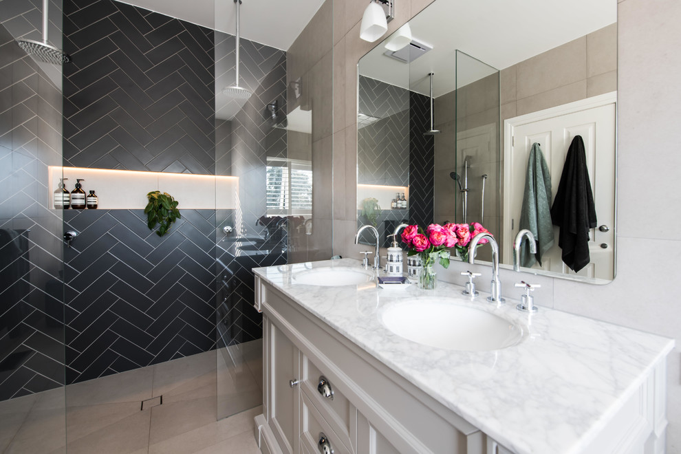 Inspiration for a large contemporary master multicolored tile and ceramic tile ceramic tile and beige floor bathroom remodel in Melbourne with furniture-like cabinets, gray cabinets, a one-piece toilet, black walls, an undermount sink, marble countertops and white countertops