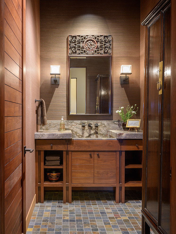 Example of a trendy multicolored floor bathroom design in Seattle with an integrated sink, medium tone wood cabinets, flat-panel cabinets and gray countertops