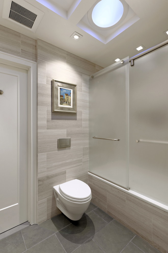 Mid-sized trendy kids' gray tile and marble tile slate floor and gray floor bathroom photo in DC Metro with furniture-like cabinets, medium tone wood cabinets, a wall-mount toilet, gray walls, a vessel sink, limestone countertops and gray countertops