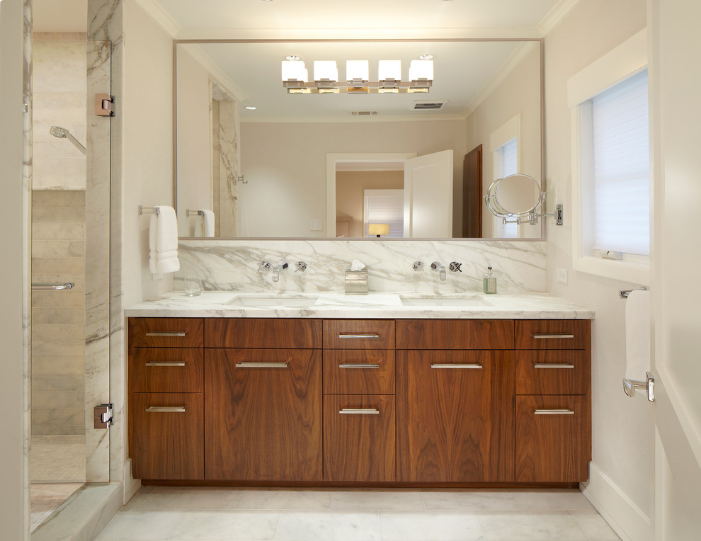 Contemporary bathroom in Dallas with a submerged sink, flat-panel cabinets, medium wood cabinets, marble worktops, an alcove shower, white tiles and marble tiles.