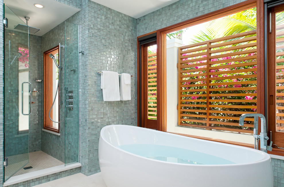 Example of a trendy mosaic tile freestanding bathtub design in Denver