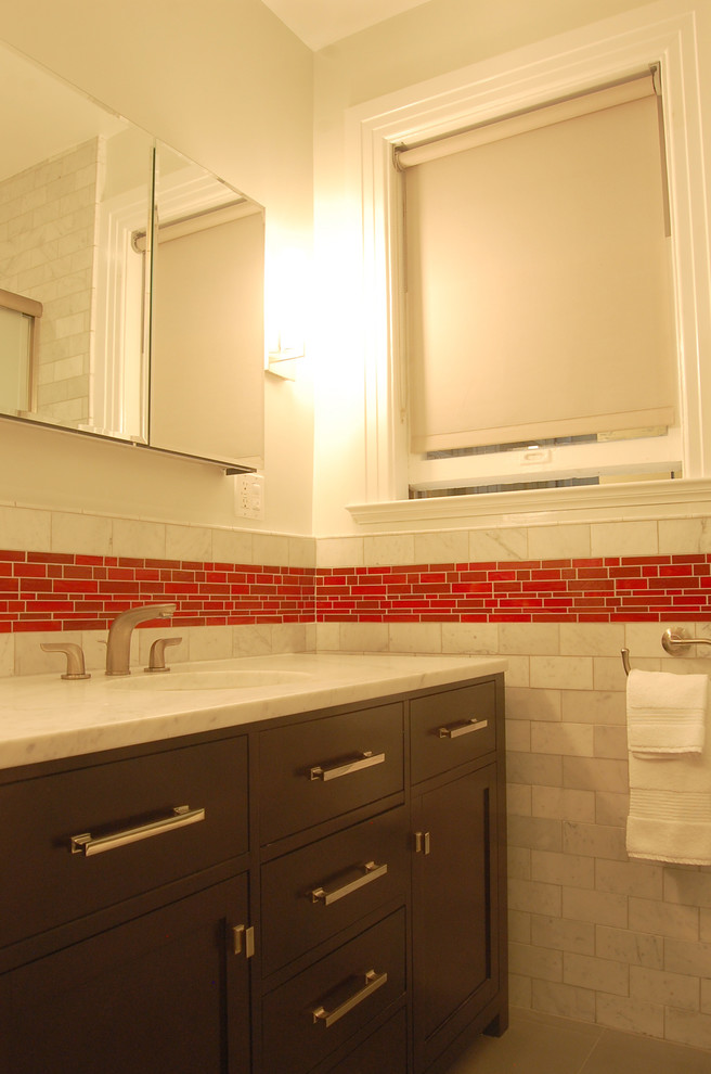 Example of a trendy mosaic tile bathroom design in San Francisco with marble countertops and an undermount sink