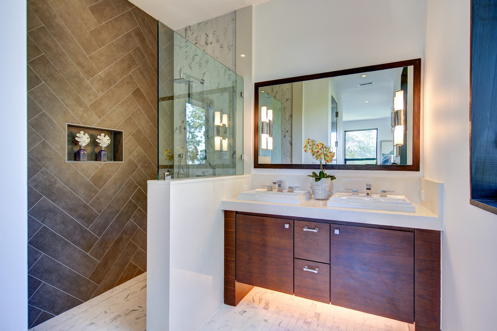 Inspiration for a large contemporary bathroom in San Francisco with flat-panel cabinets, dark wood cabinets, a walk-in shower, brown tiles, porcelain tiles, white walls, a built-in sink, quartz worktops, porcelain flooring, an open shower and white floors.