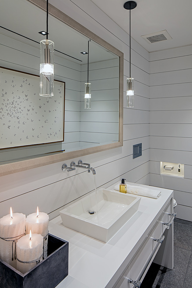 Inspiration for a contemporary bathroom remodel in Toronto with a vessel sink, white cabinets and white walls