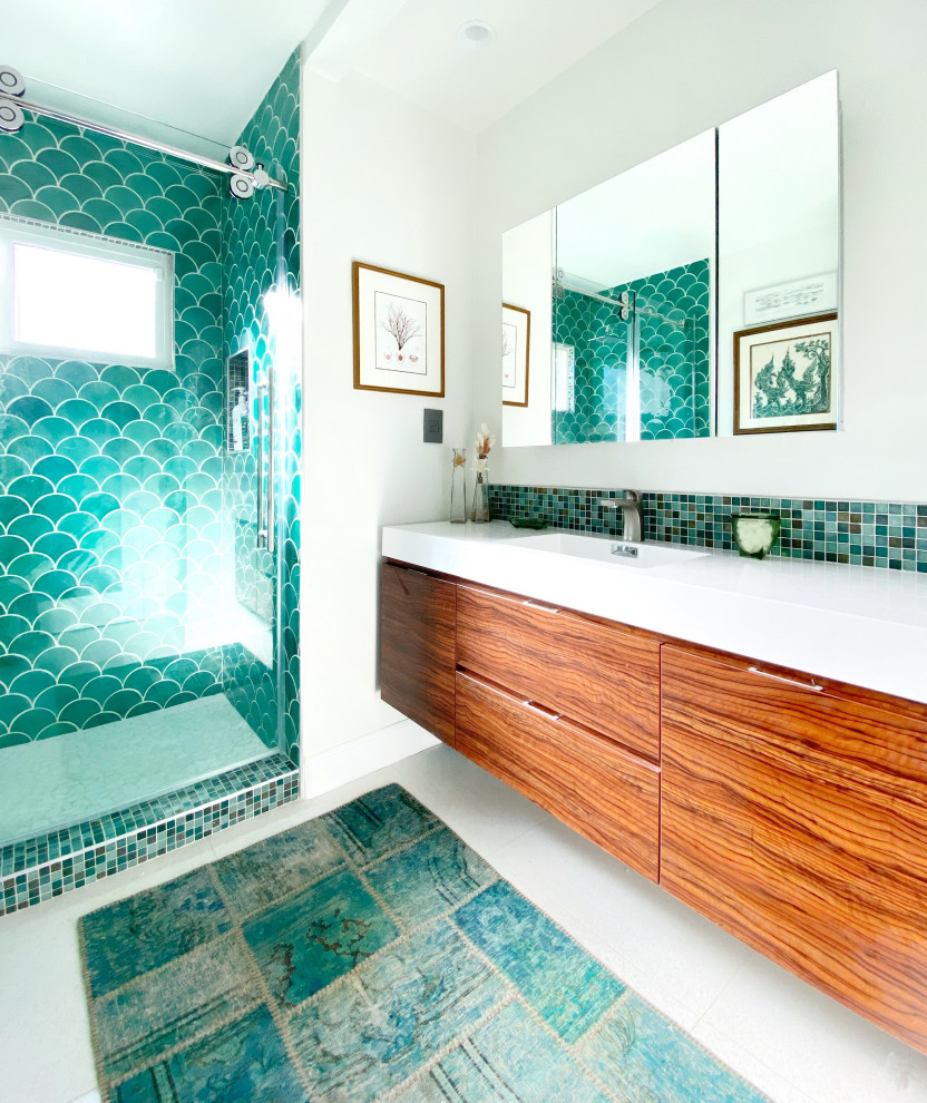 Example of a mid-sized trendy 3/4 green tile, multicolored tile and mosaic tile white floor and single-sink bathroom design in San Diego with flat-panel cabinets, medium tone wood cabinets, an integrated sink, white countertops and a floating vanity