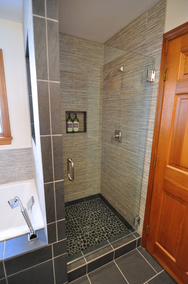 Medium sized contemporary ensuite bathroom in Boston with a submerged sink, flat-panel cabinets, medium wood cabinets, engineered stone worktops, a built-in bath, an alcove shower, a two-piece toilet, grey tiles, ceramic tiles, grey walls and ceramic flooring.