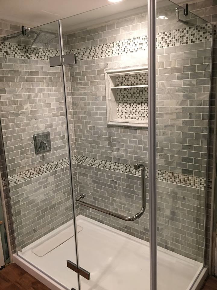 Design ideas for a contemporary bathroom in Bridgeport with a corner shower, grey tiles, ceramic tiles and a hinged door.