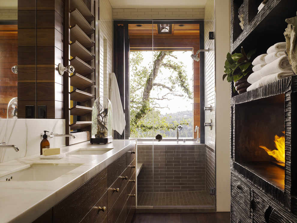 Inspiration for a contemporary brown tile alcove shower remodel in San Francisco with an undermount sink and open cabinets