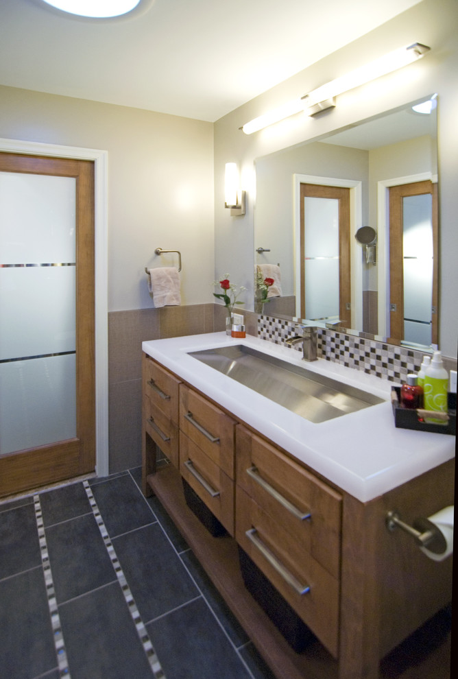Inspiration for a contemporary bathroom remodel in DC Metro with medium tone wood cabinets
