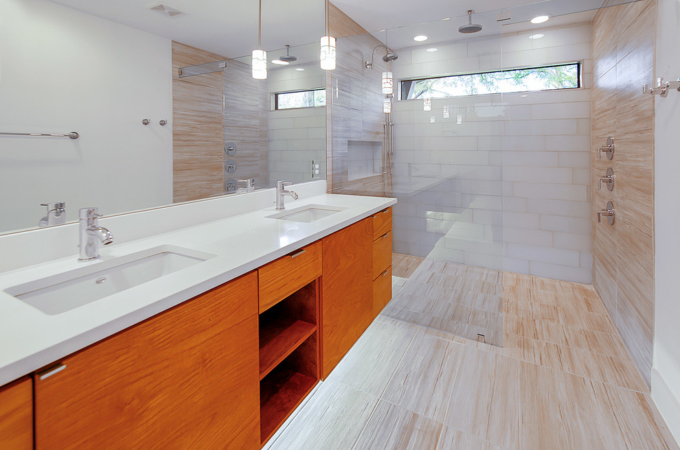 Cette image montre une salle de bain principale design en bois foncé de taille moyenne avec un placard à porte plane, une douche double, un carrelage beige, des carreaux de porcelaine, un mur blanc, un sol en carrelage de céramique, un lavabo encastré et un plan de toilette en granite.
