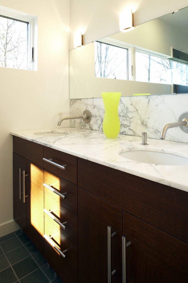 This is an example of a contemporary bathroom in Boston with a submerged sink, flat-panel cabinets, dark wood cabinets and white tiles.