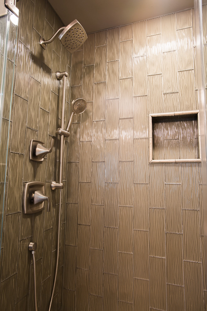 Example of a mid-sized mountain style green tile and glass tile ceramic tile walk-in shower design in New York with an undermount sink, recessed-panel cabinets, brown cabinets, granite countertops, a one-piece toilet and green walls