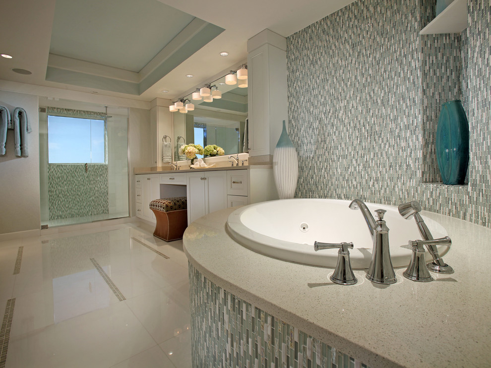 This is an example of a contemporary bathroom in Miami with a submerged sink, a built-in bath and a walk-in shower.