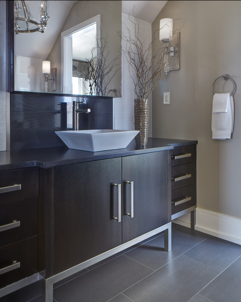 Inspiration for a large contemporary bathroom in Charleston with flat-panel cabinets, dark wood cabinets, beige walls, porcelain flooring and a vessel sink.