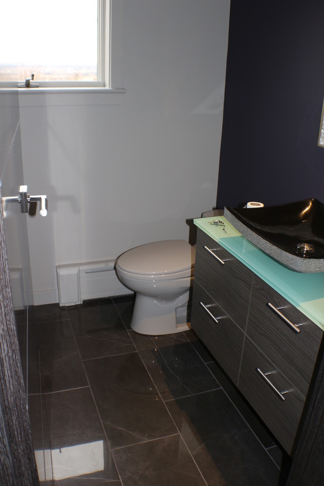 Small contemporary shower room bathroom in Other with a vessel sink, freestanding cabinets, grey cabinets, glass worktops, a one-piece toilet, grey tiles, porcelain tiles, purple walls and porcelain flooring.