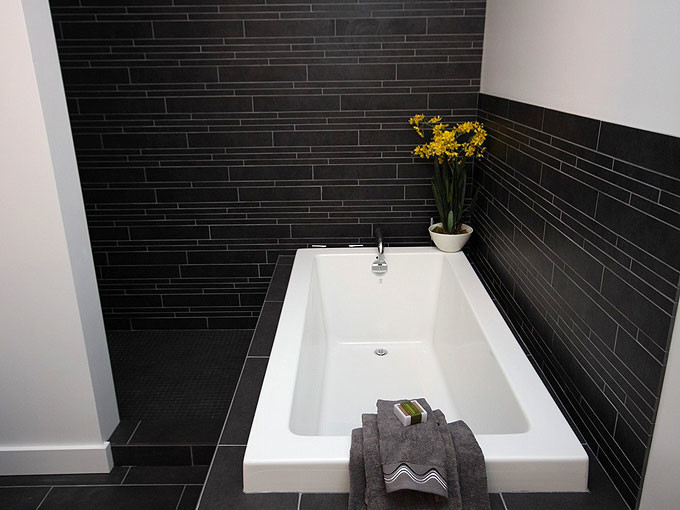 Inspiration for a mid-sized contemporary master black tile and porcelain tile porcelain tile bathroom remodel in Calgary with a vessel sink, flat-panel cabinets, light wood cabinets, granite countertops, a two-piece toilet and white walls