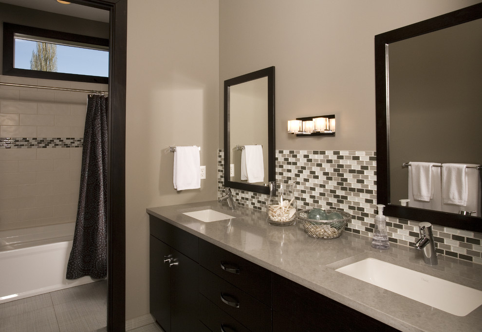 Bathroom - contemporary multicolored tile and mosaic tile bathroom idea in Seattle with an undermount sink and black cabinets