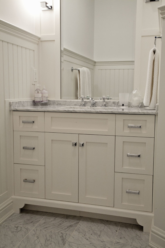 Inspiration for a small farmhouse kids' porcelain tile and gray floor bathroom remodel in New York with shaker cabinets, white cabinets, an undermount sink, marble countertops and white walls