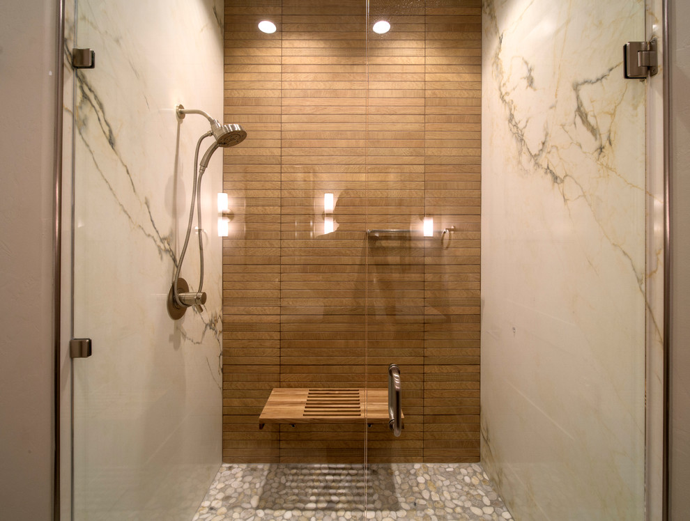 Contemporary shower room bathroom in Other with an alcove shower, marble tiles, pebble tile flooring, multi-coloured floors and a hinged door.