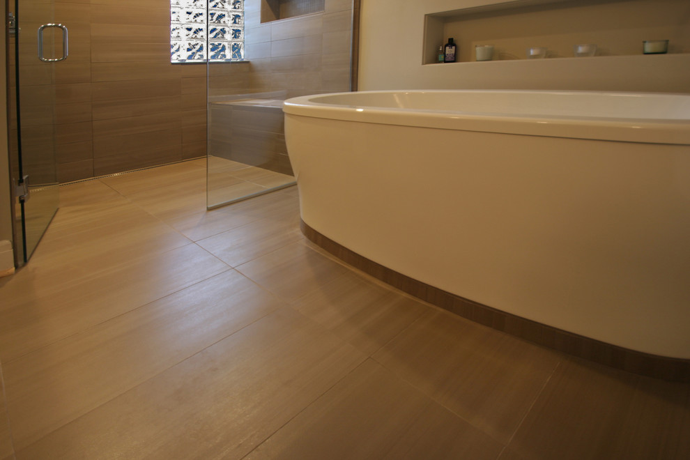 Example of a master beige tile and porcelain tile porcelain tile bathroom design in Detroit with an undermount sink, recessed-panel cabinets, dark wood cabinets, quartz countertops, a one-piece toilet and beige walls