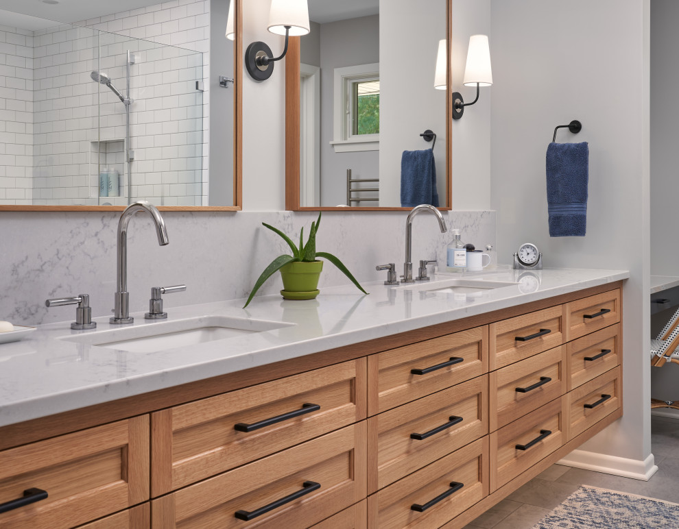 Design ideas for a traditional ensuite bathroom in Minneapolis with marble worktops, white worktops, double sinks, recessed-panel cabinets, medium wood cabinets, grey walls, a submerged sink, grey floors and a floating vanity unit.