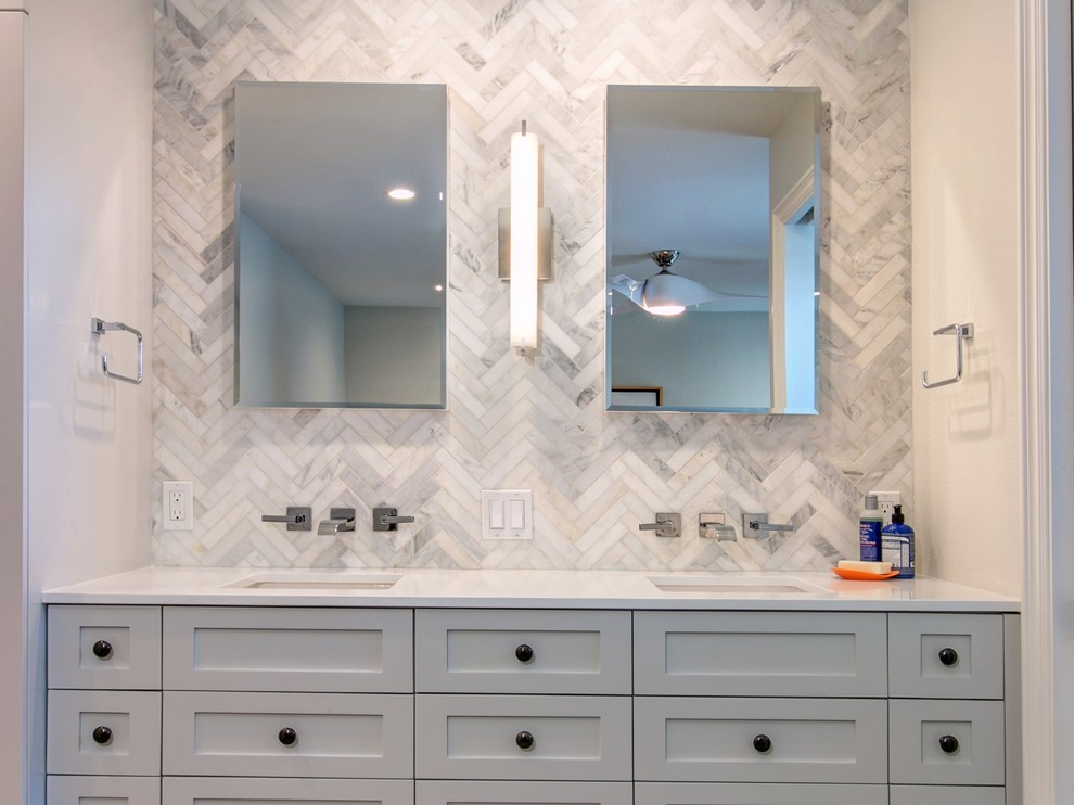 Tub/shower combo - mid-sized contemporary master white tile and porcelain tile ceramic tile tub/shower combo idea in San Diego with shaker cabinets, gray cabinets, a one-piece toilet, gray walls, a wall-mount sink and quartz countertops