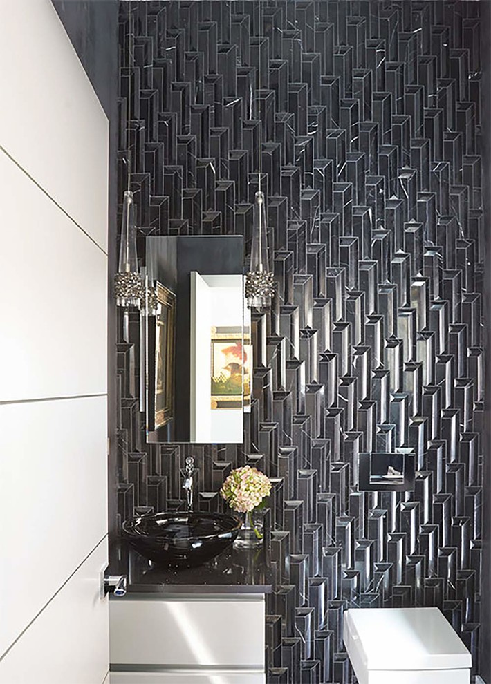 Small trendy master black and white tile and ceramic tile ceramic tile and black floor bathroom photo in Orange County with flat-panel cabinets, white cabinets, a one-piece toilet, multicolored walls, a vessel sink, granite countertops, a hinged shower door and black countertops