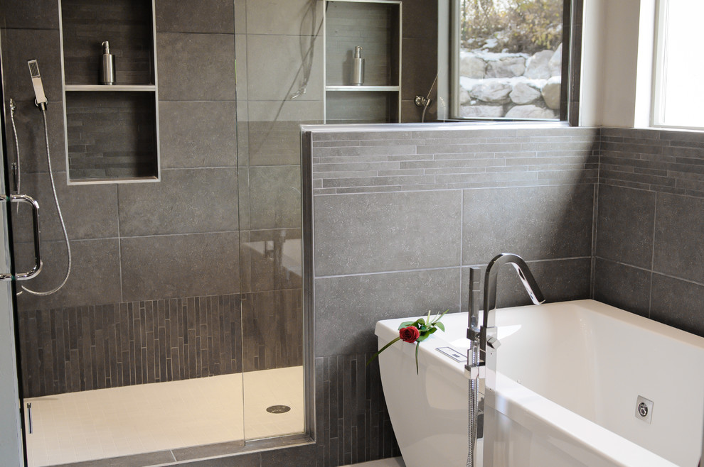 Large trendy master gray tile and porcelain tile porcelain tile and white floor bathroom photo in Salt Lake City with shaker cabinets, medium tone wood cabinets, gray walls, a vessel sink, quartz countertops, a hinged shower door and a two-piece toilet