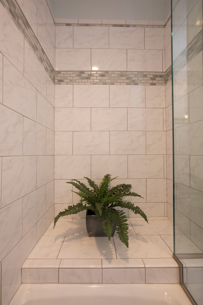 Example of a small trendy kids' white tile and cement tile ceramic tile and gray floor bathroom design in Raleigh with recessed-panel cabinets, white cabinets, a two-piece toilet, blue walls, an undermount sink, quartz countertops, a hinged shower door and white countertops