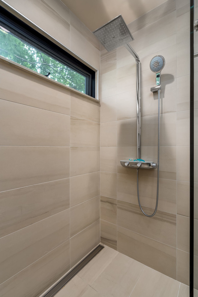 Inspiration for a small contemporary bathroom in Columbus with flat-panel cabinets, dark wood cabinets, a wall mounted toilet, beige tiles, porcelain tiles, beige walls, porcelain flooring, an integrated sink, concrete worktops, beige floors, an open shower and grey worktops.