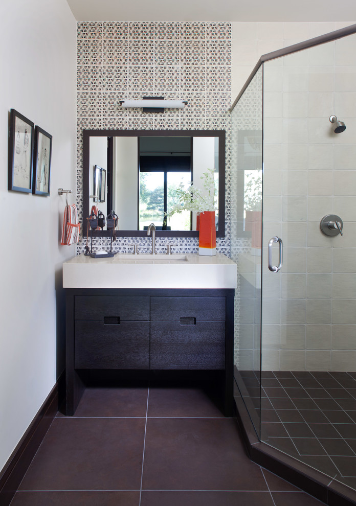 Example of a trendy multicolored tile corner shower design in Denver with an undermount sink, flat-panel cabinets and dark wood cabinets
