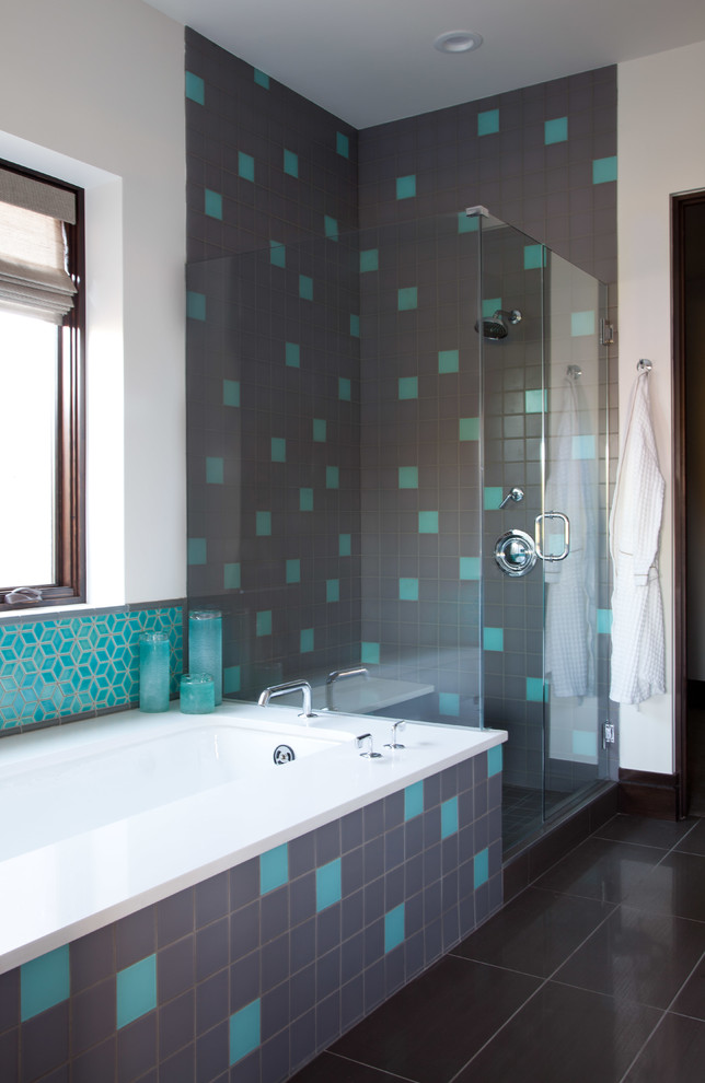 Example of a trendy multicolored tile corner shower design in Denver with an undermount tub