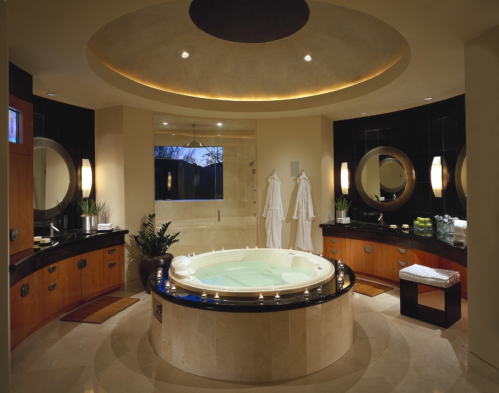 Пример оригинального дизайна: ванная комната в современном стиле с накладной раковиной, плоскими фасадами, фасадами цвета дерева среднего тона, столешницей из гранита, накладной ванной, душем в нише, бежевой плиткой и каменной плиткой