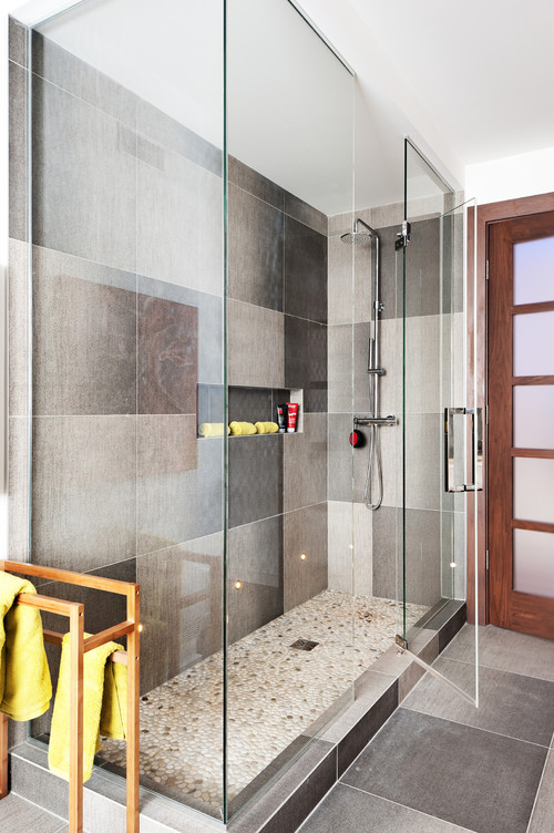 Pebble Shower Floor Tiles with Sleek Chrome Fixtures