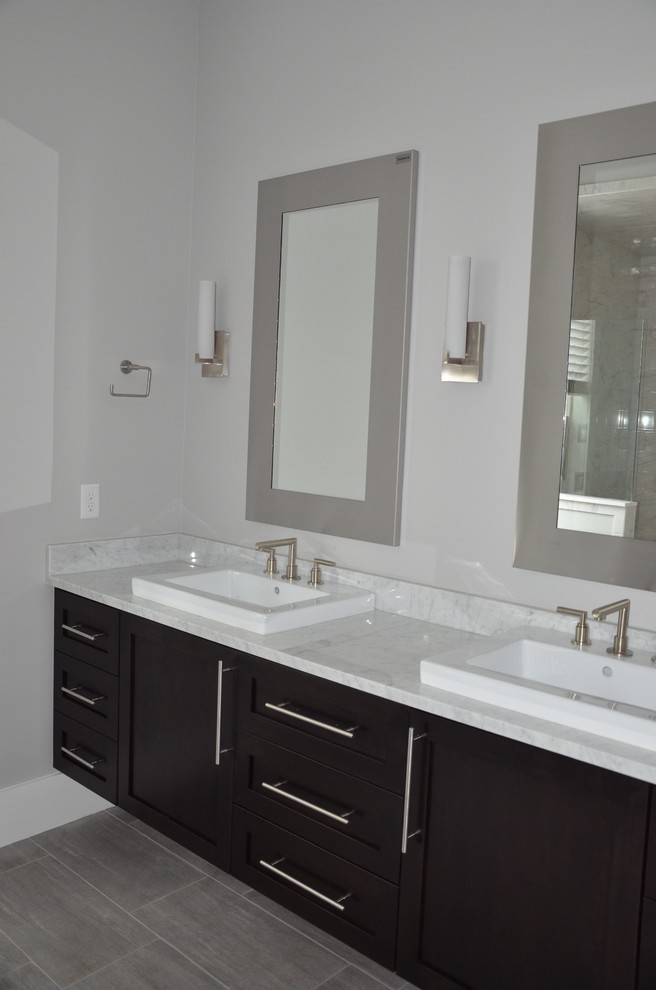 Example of a trendy master gray tile and ceramic tile ceramic tile bathroom design in Jacksonville with a vessel sink, shaker cabinets, dark wood cabinets, marble countertops and gray walls