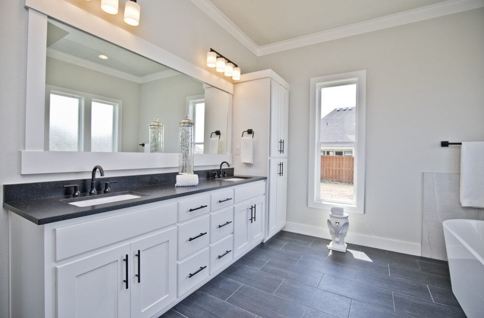 Design ideas for a contemporary bathroom in Other with granite worktops and black worktops.