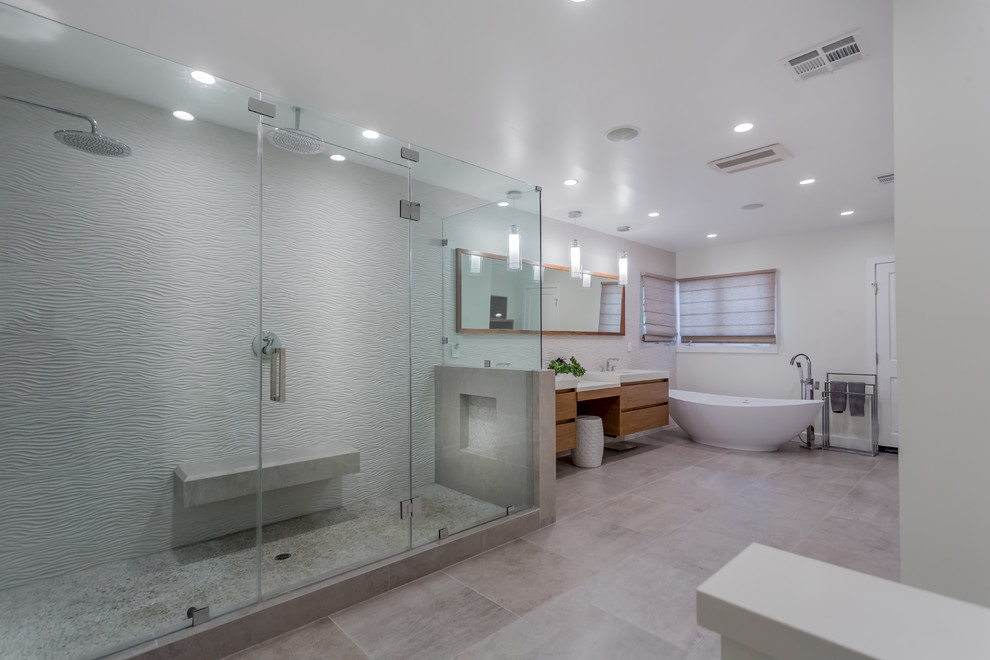 Bathroom - large contemporary master porcelain tile bathroom idea in San Francisco with flat-panel cabinets, medium tone wood cabinets, white walls, an integrated sink, solid surface countertops and a hinged shower door